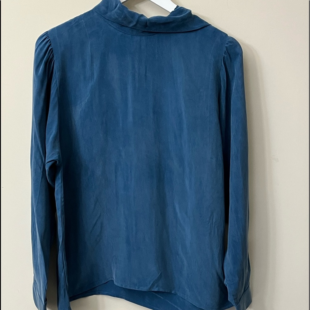 This is a blouse, the brand is Amour Vert, size M.